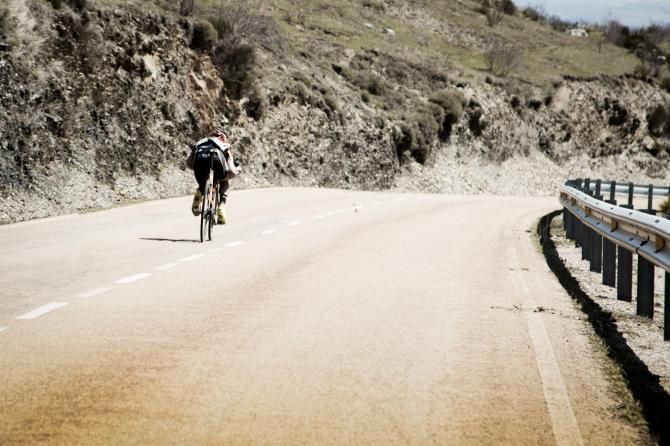 Alex Candelario goes into a tuck, speedily descending a steep grade at the Vuelta de Castilla y Leon