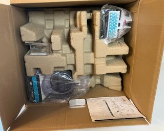 Unboxing the Shark CarpetXpert with Stainstriker Carpet Cleaner with plastic and molded cardboard in box