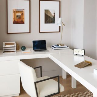 White desk with white chair and laptop