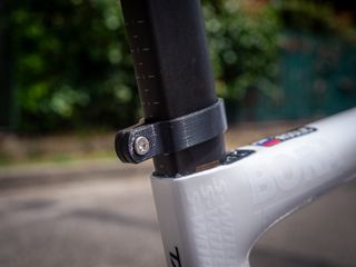 On the seat post of the bike is a small 3D-printed race number holder