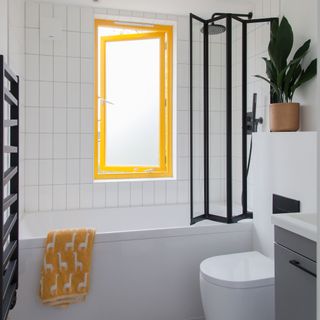 small bathroom yellow window frames