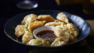 Chicken gyoza with spring onion and sprouts