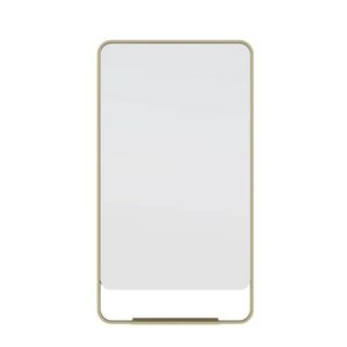 A curved brass rectangular mirror with a shelf on it