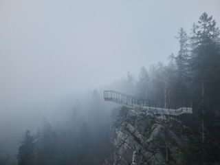 Mountain lookout structure in low cloud