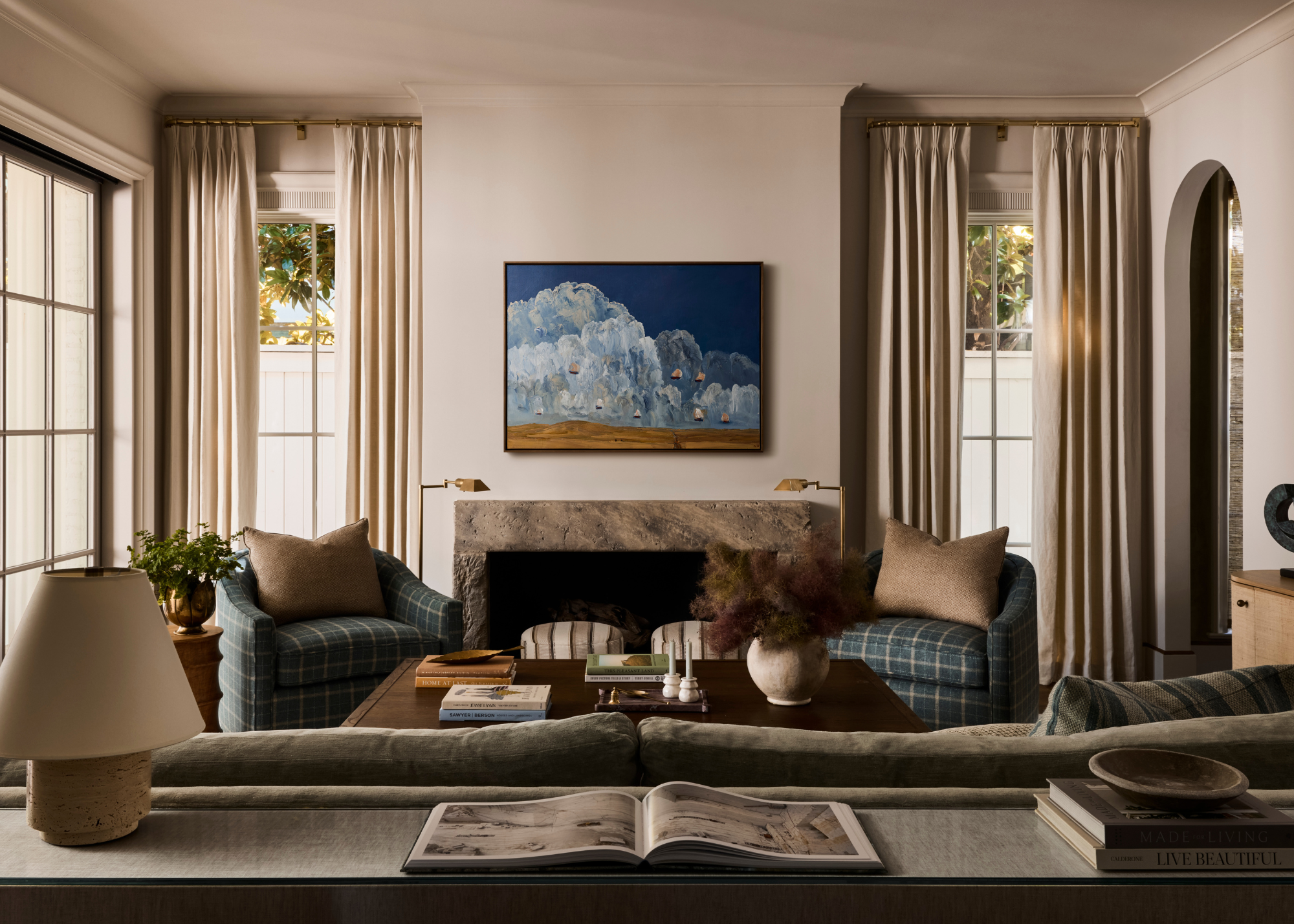 light and airy living room with a fireplace