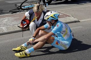 Janez Brajkovic (Astana) sits on the pavement after crash