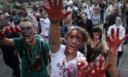 A zombie flashmob: Zombies have inspired movies, Halloween costumes, and even Occupy Wall Street garb giving a boost to the near-dead economy.
