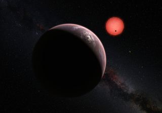 Scientists have found three alien planets orbiting an ultra-cool dwarf star about 40 light-years from Earth and they might have the potential to support life. This artist's illustration depicts a view of the three TRAPPIST-1 system planets, with one of th