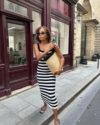 Woman wearing a black and white outfit in France.