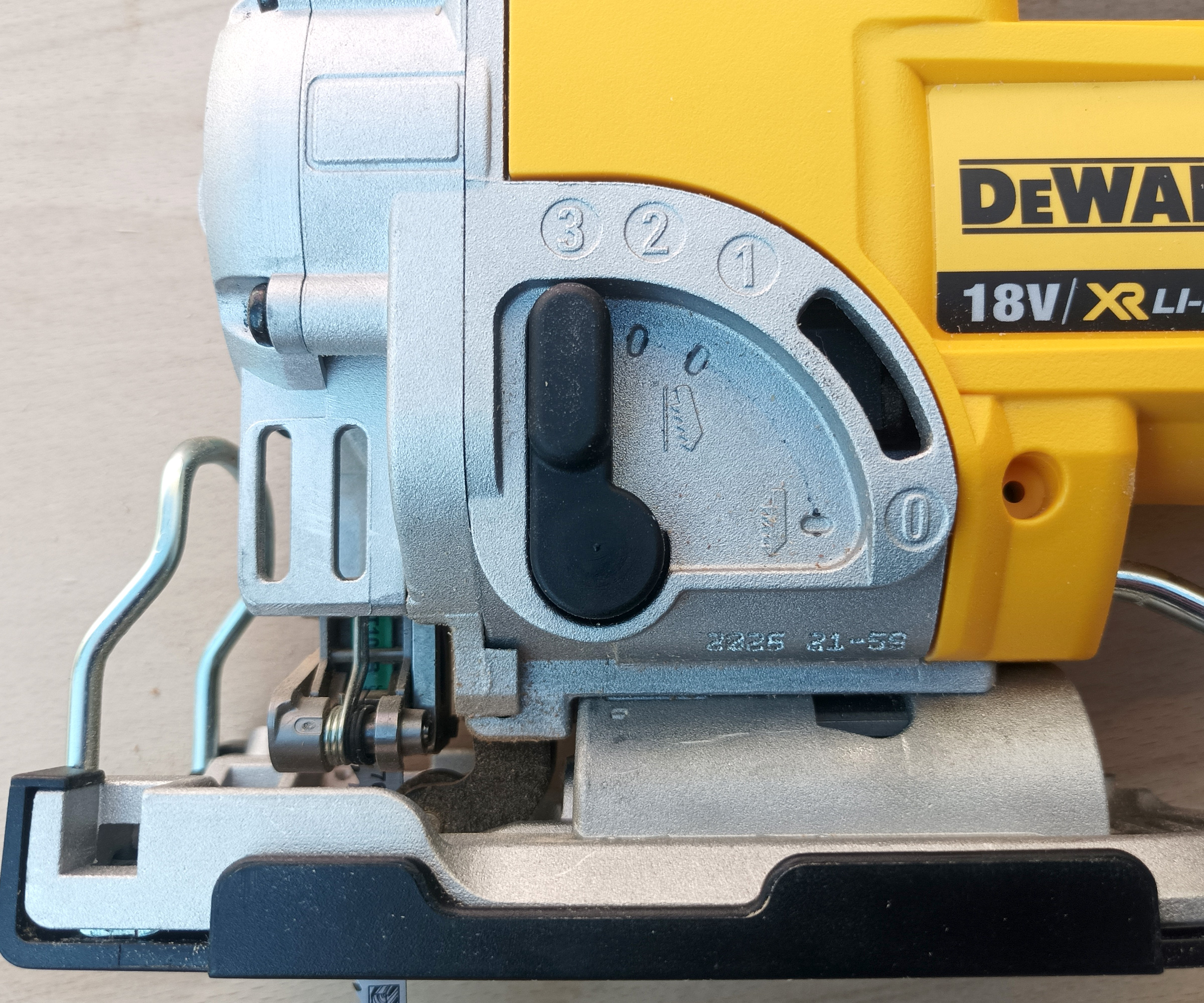 Close of orbital action lever on DeWalt DCS331N Cordless Jigsaw