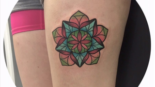 Stained glass mandala tattoo