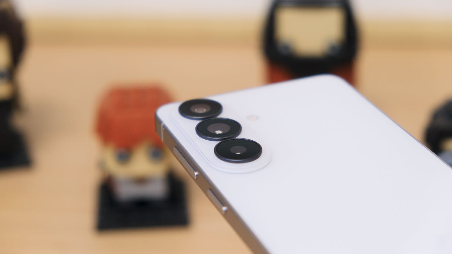 The Samsung Galaxy S26 resting on a wooden table