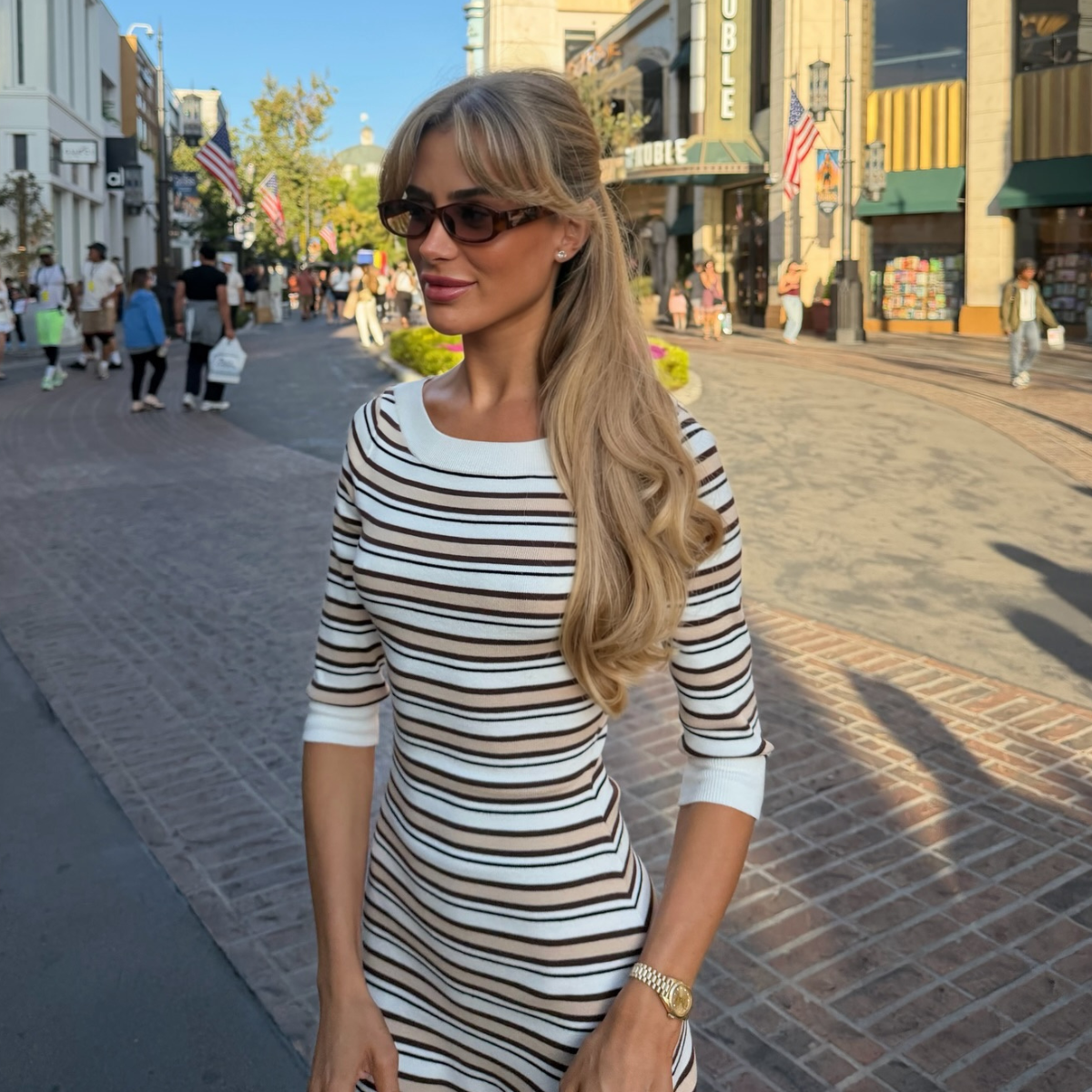 An image of a woman wearing striped dress for summer 2026