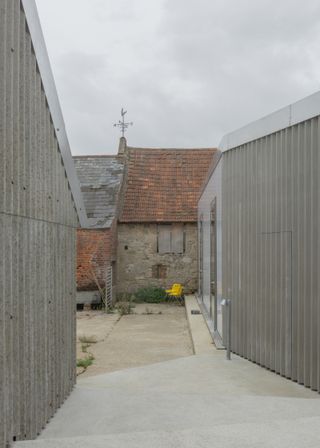 Looking down into the new central courtyard, with the ancient barn beyond