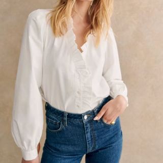 close up of woman wearing white shirt 