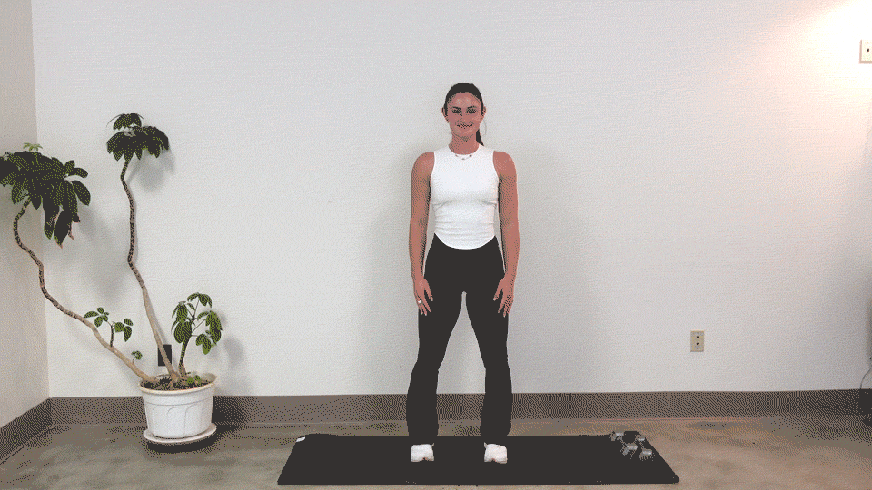 Trainer Kirra Mitlo doing straight arm bodyweight curls