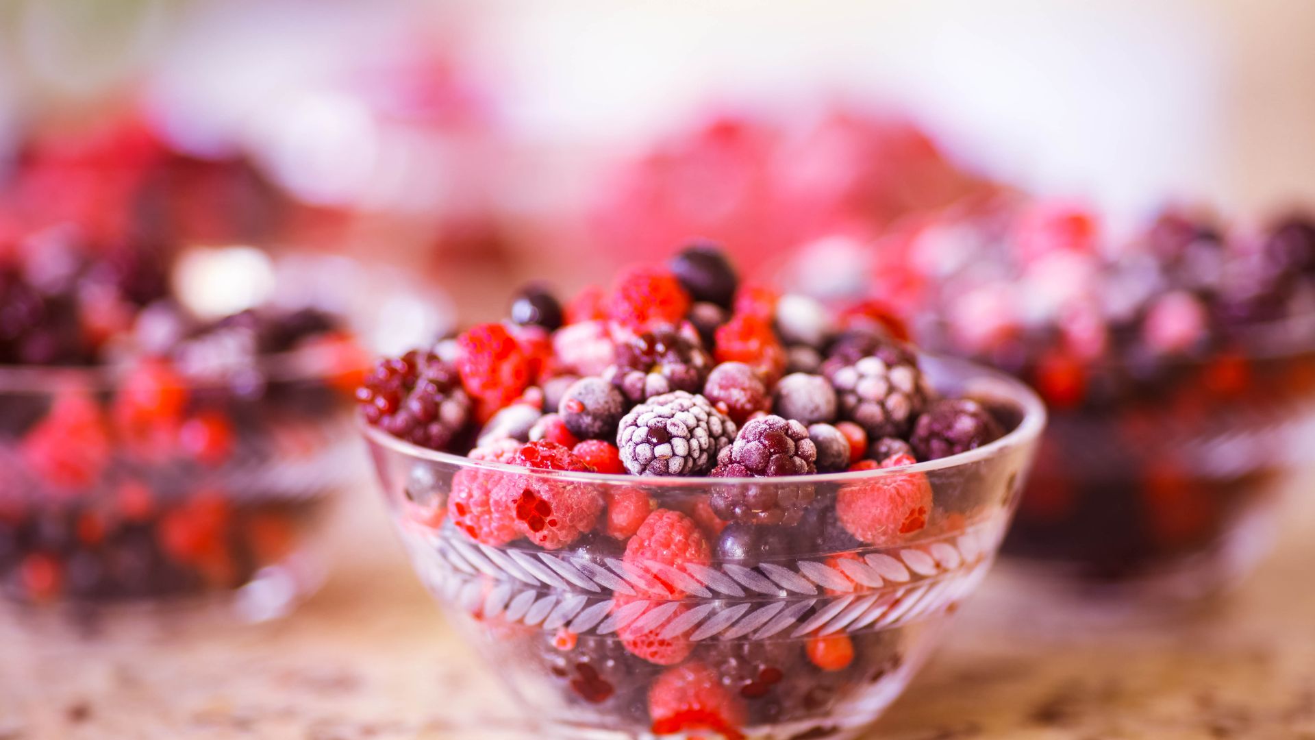Dish filled with frozen red berries