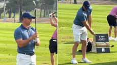 Rory McIlroy warms up with a small golf club