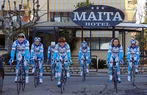 The Nobili Rubinettere pose outside their hotel