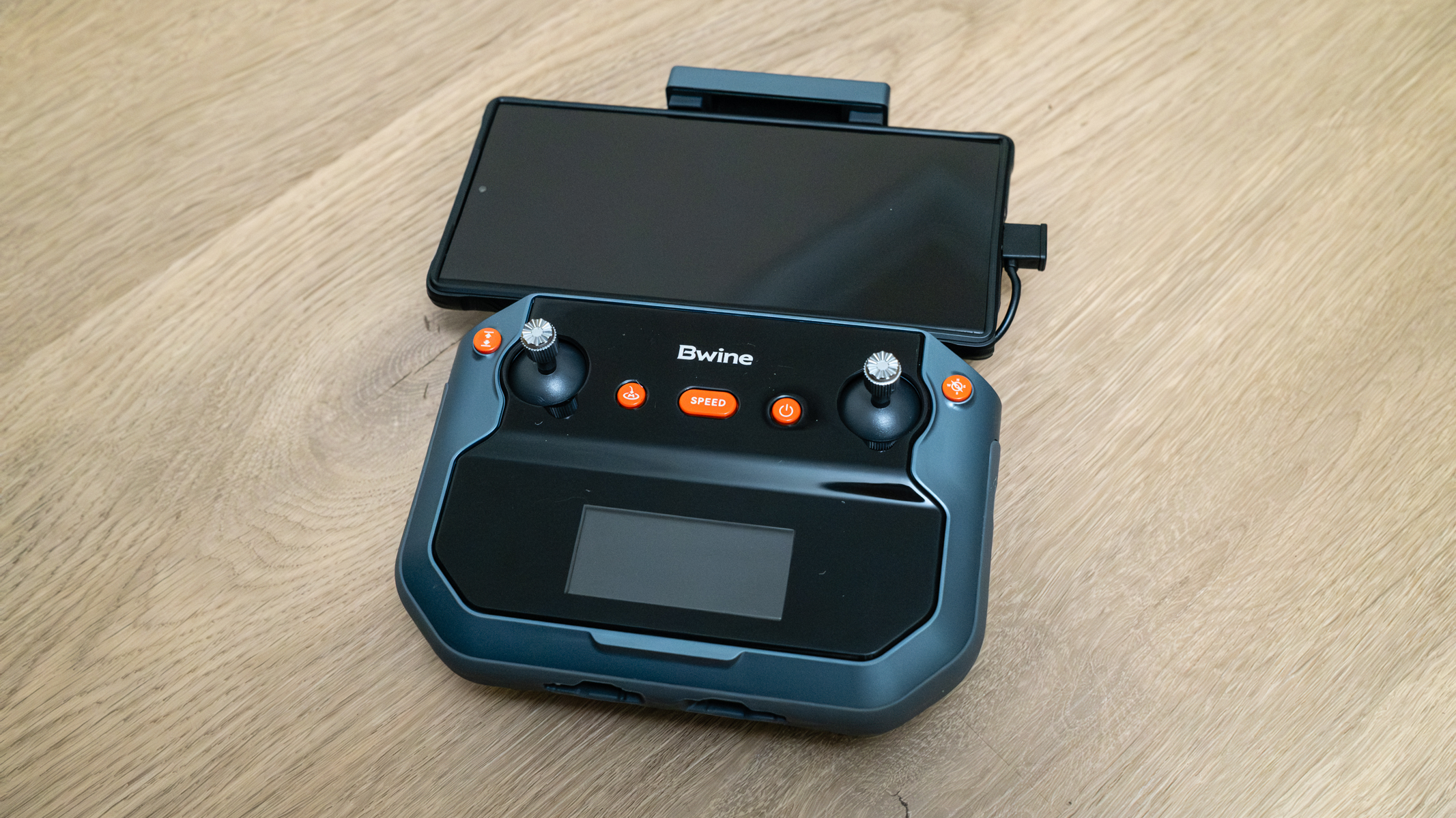 Bwine F7GIM controller with a smartphone attached