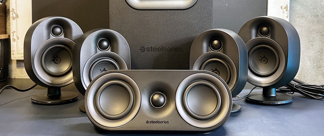 SteelSeries Arena 9 speakers on desk with subwoofer.