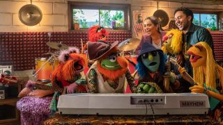 Lilly Singh and Tahj Mowry rocking out with The Electric Mayhem in The Muppets Mayhem