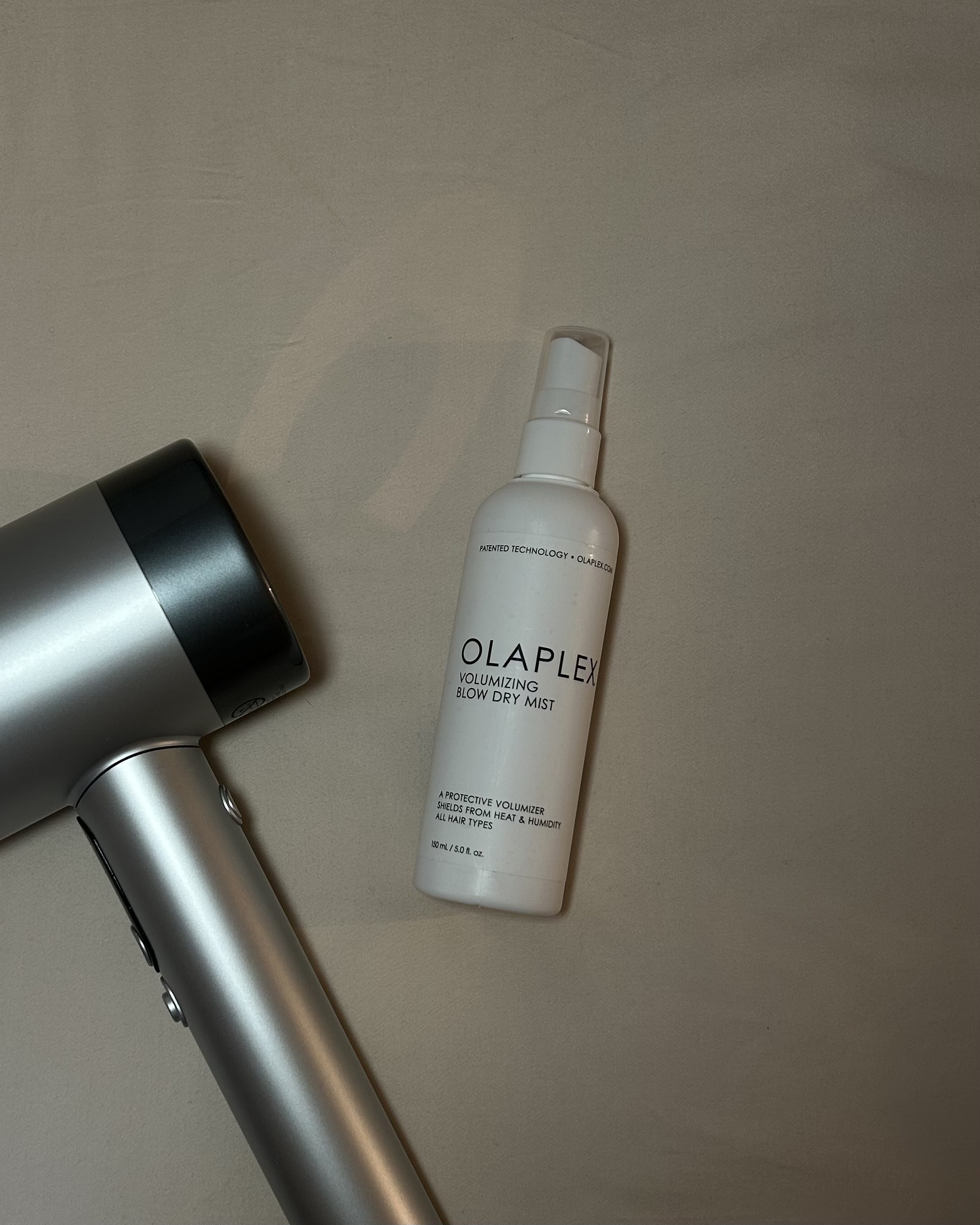An image of the Olaplex Volumizing Blow Dry Mist by Alyssa Brascia.