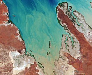 Valentine Island in northern Western Australia is a swirling mix of blues and reddish browns, as seen from space by the Copernicus Sentinel-2 mission. The mission, which is made up of two satellites, imaged the tiny island for Valentine's Day. Valentine Island is just about 1 mile (1.60 kilometers) long and 0.15 miles (250 meters) wide and can be found in the King Sound, a large gulf that has one of the highest tides in all of Australia.