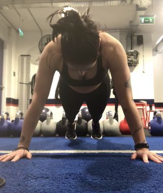 Sam performing a push-up during F45 workout