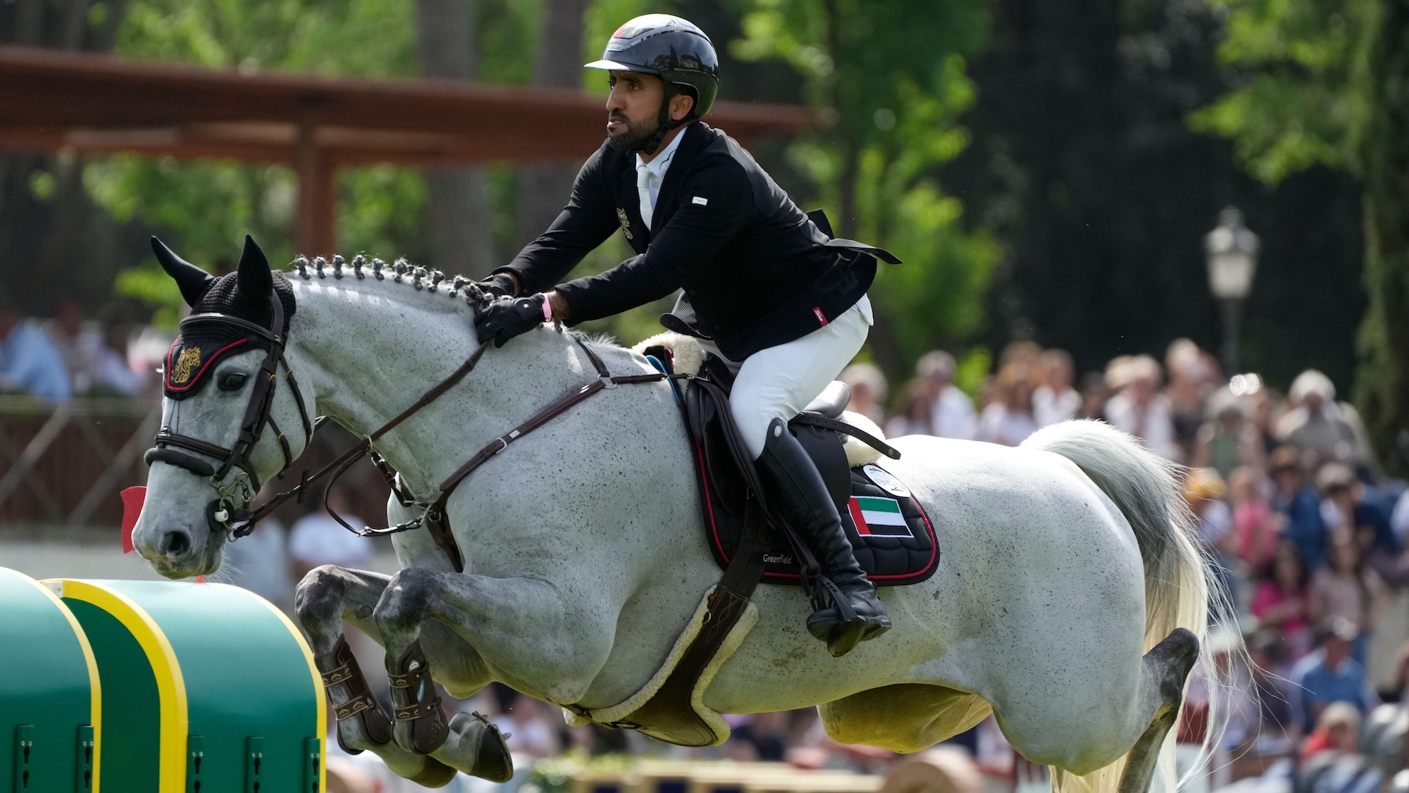 Abdullah Mohd Al Marri and BBS McGregor jumping a fence