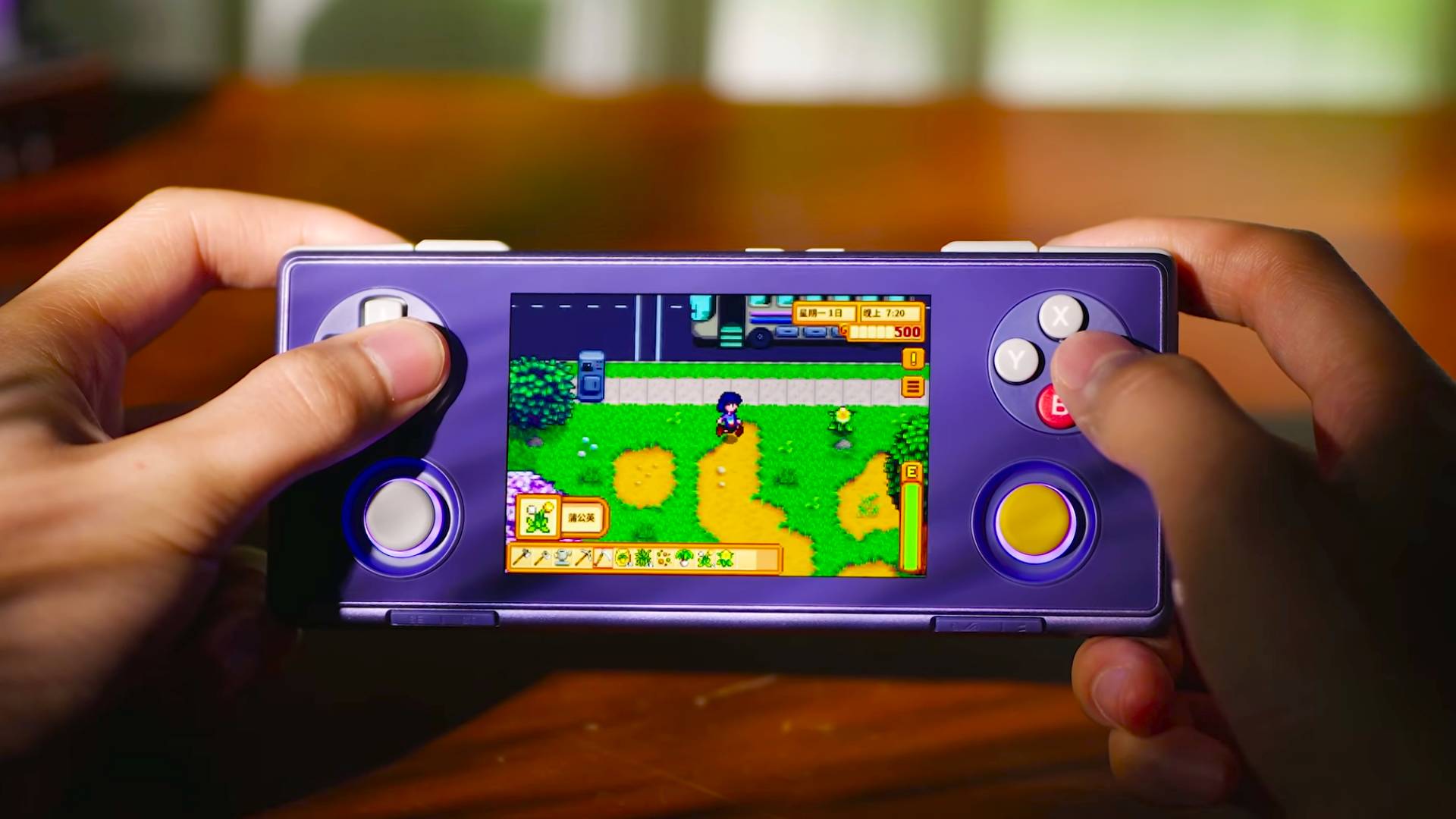 Hands using Ayaneo Pocket Micro 2 handheld in Stardust Purple to play Stardew Valley.