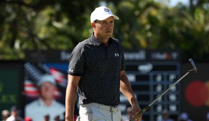 Spieth walks with putter in his hand