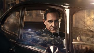 Bertie Carvel as Commander Adam Dalgliesh sits at the wheel of a car in Dalgliesh season 3