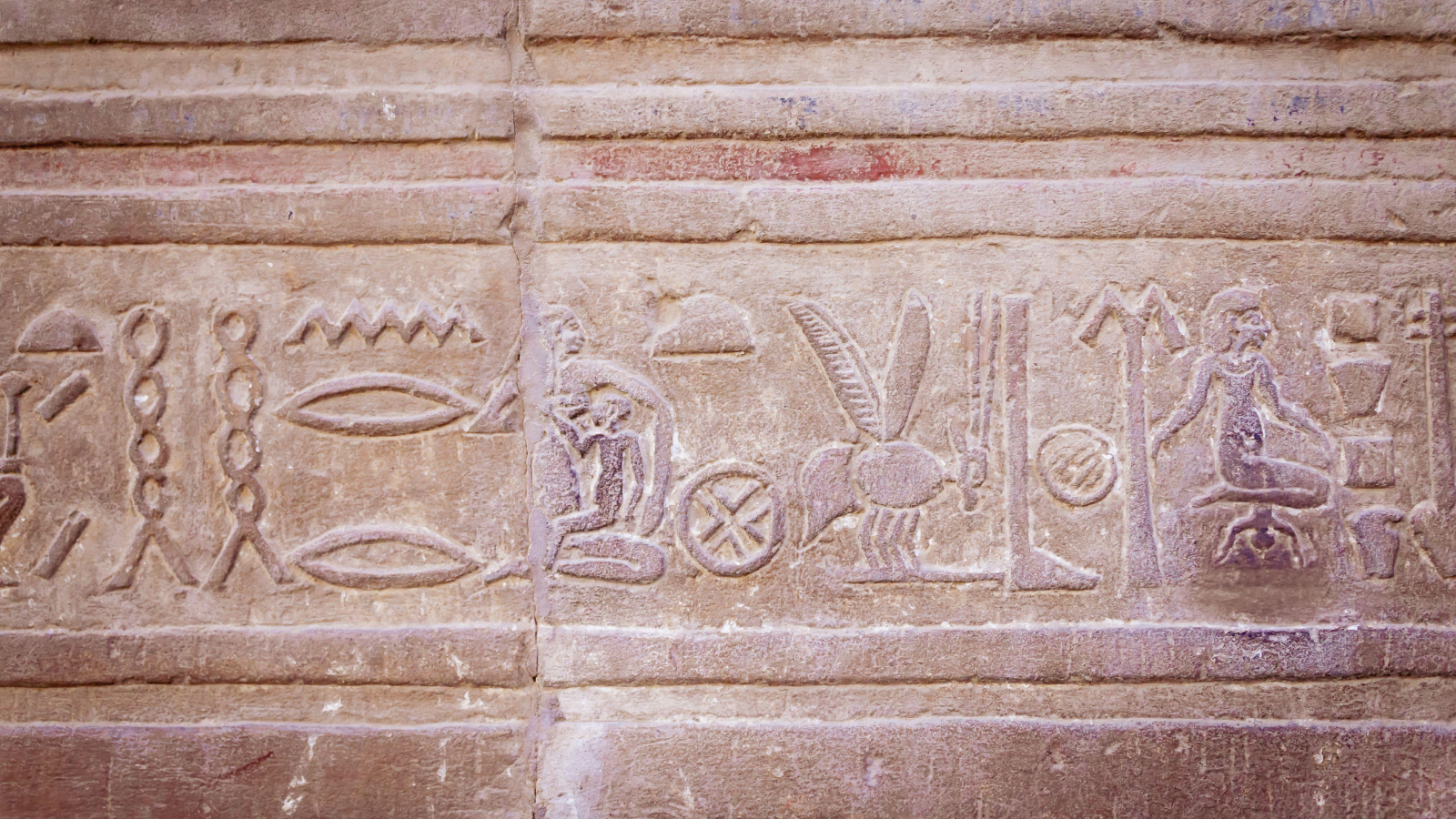 Ancient Egyptian Hieroglyph showing childbirth and motherhood.