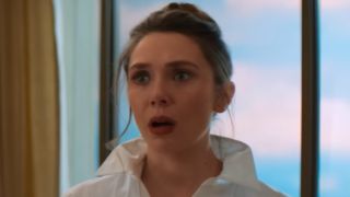 Elizabeth olsen in Eternity standing with her mouth open. 