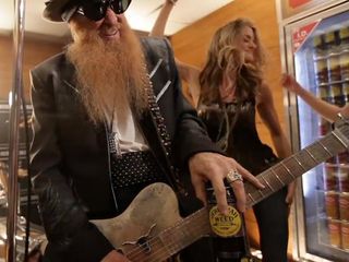 Billy Gibbons slides around with a friend