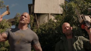 Dwayne Johnson and Jason Statham walking into battle holding weapons in Fast & Furious Presents: Hobbs and Shaw.
