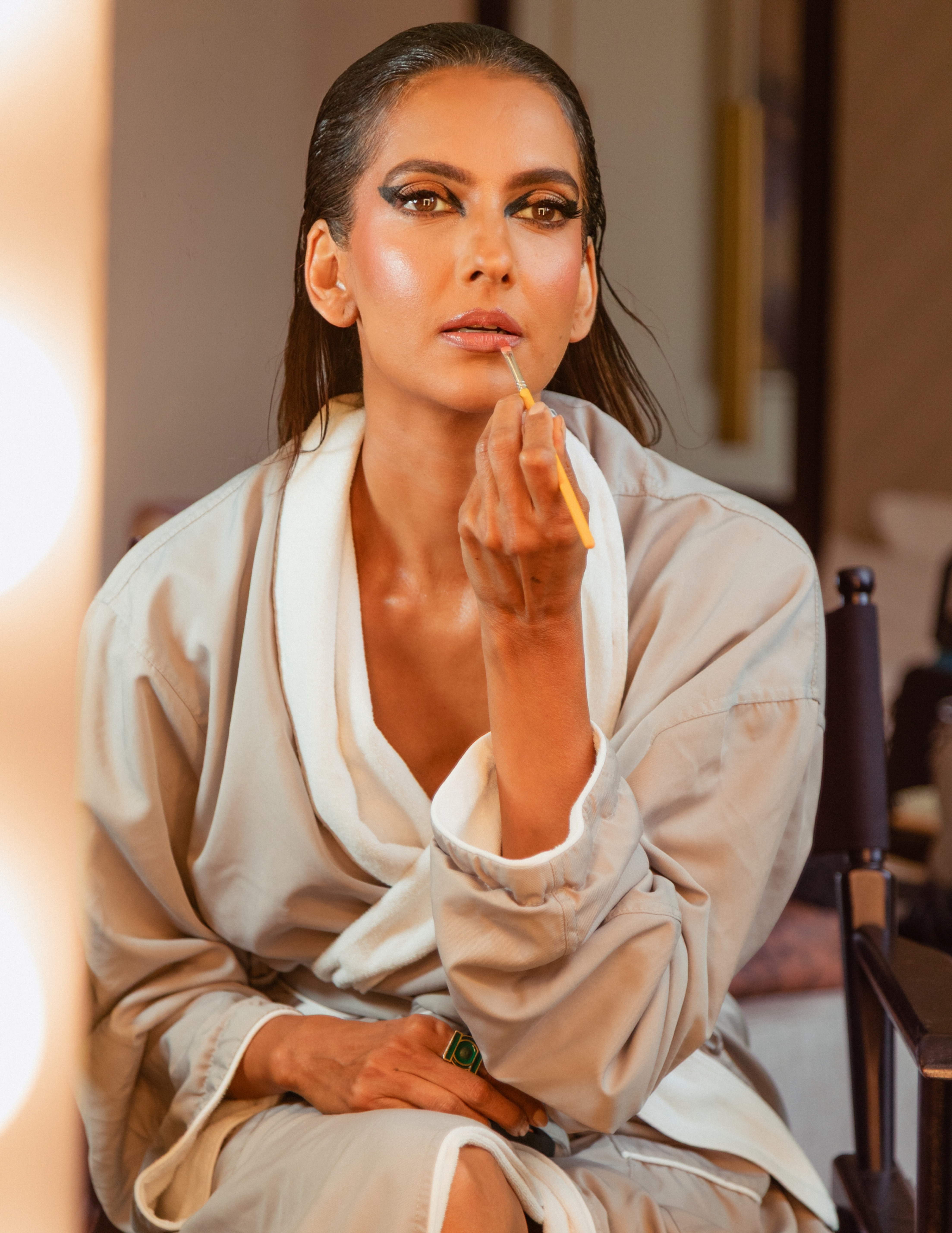 Poorna Jagannathan getting ready for the premiere of 'Lanterns' in L.A., wearing a black-and-green cool from Mugler.