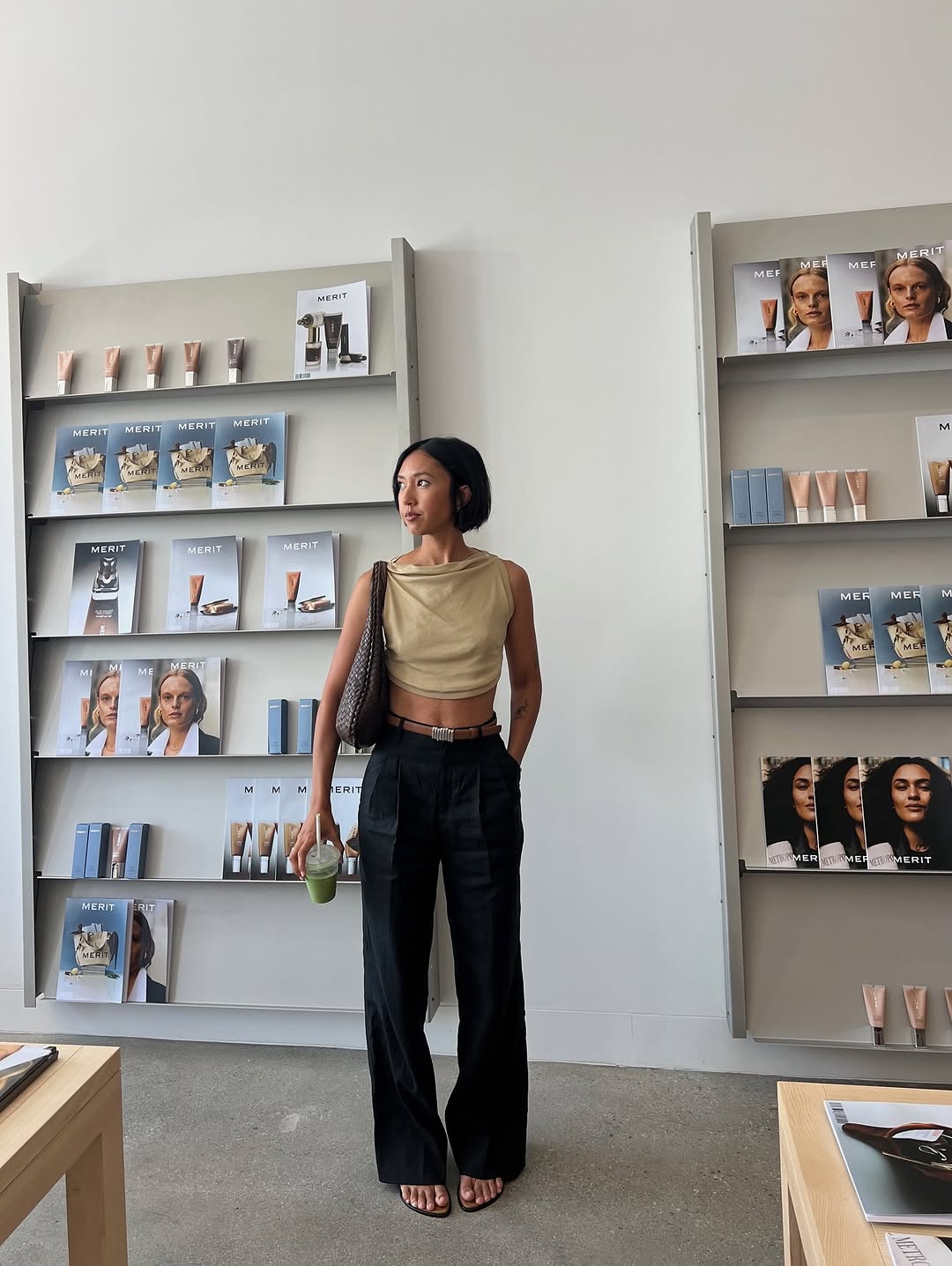 Woman wearing trouser pants and flip flops summer 2025.