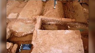 The individual's burial in the ancient basilica.