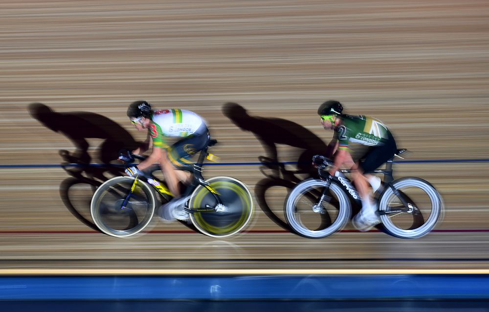 Callum Scotson of Australia (L) leads Mark Cavendish of Great Britain during the Mens Madison Chase on day four of the London Six Day