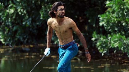 Akshay Bhatia goes topless for a shot at the Honda Classic