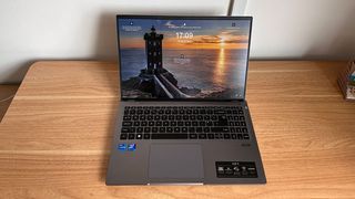 Acer Swift X 16 laptop open on a wooden desk