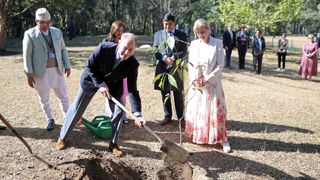 Prince Edward plants a tree whilst Duchess Sophie watches as they visit the National Botanic Garden during an official visit to Nepal on February 06, 2025