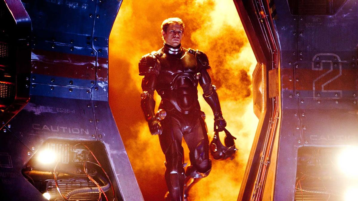 Charlie Hunnam heroically walking with fire raging behind him in Pacific Rim.