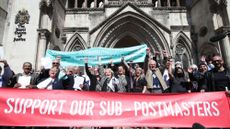Former post office workers celebrating outside the Royal Courts of Justice, London, after their convictions were overturned by the Court of Appeal