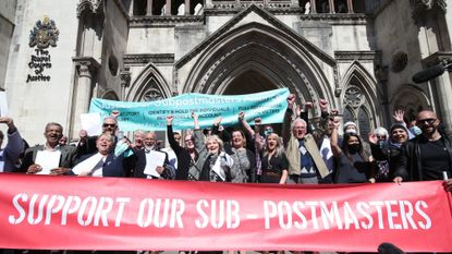 Former post office workers celebrating outside the Royal Courts of Justice, London, after their convictions were overturned by the Court of Appeal