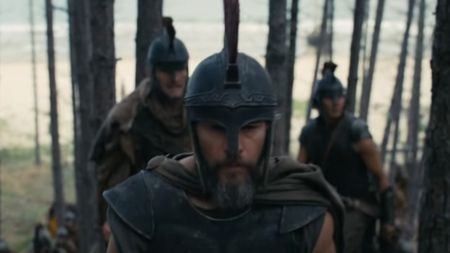 Matt Damon walking through the woods as Odysseus in The Odyssey.