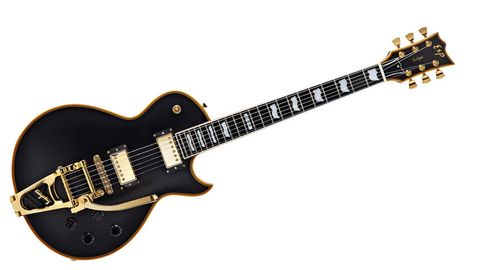 The gold-finished hardware includes a genuine (not licensed) Bigsby B7 vibrato