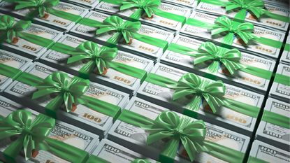 Many stacks of hundred-dollar bills wrapped in green bows.